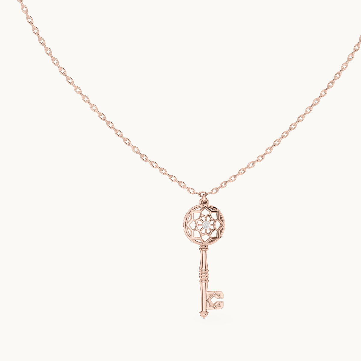 Round lab-grown diamond filigree key pendant in rose gold, 0.008 CT TW, view 1