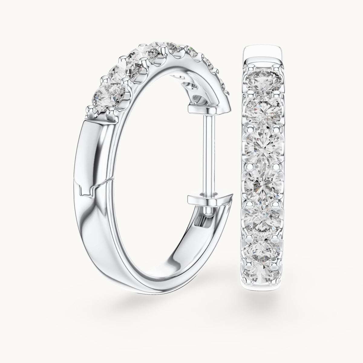 Round lab-grown diamond graduated hoop earrings in white gold, 0.70 CT TW, view 1