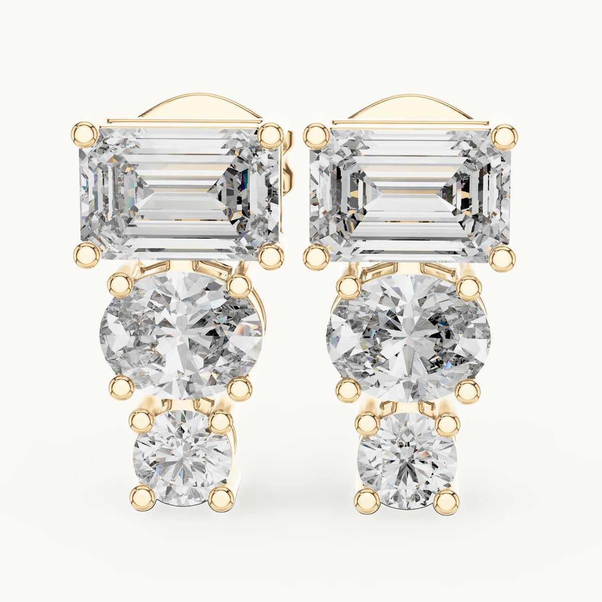 Emerald-cut, oval and round lab-grown diamond three-stone drop earrings in yellow gold, 2.38 CT TW, view 1