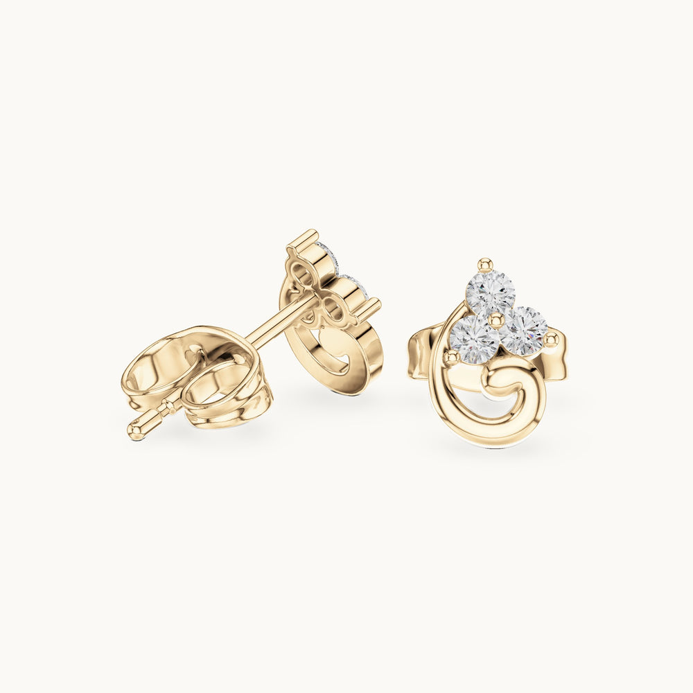 Round lab-grown diamond trio cluster swirl stud earrings in yellow gold, 0.15 CT TW, view 1