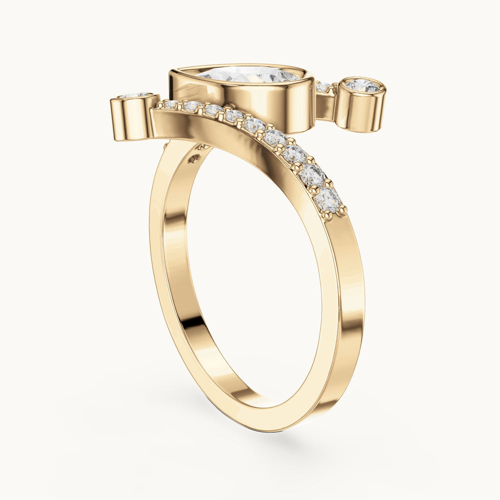 Pear lab-grown diamond open bypass ring with bezel accents in yellow gold, 0.72 CT TW, view 1