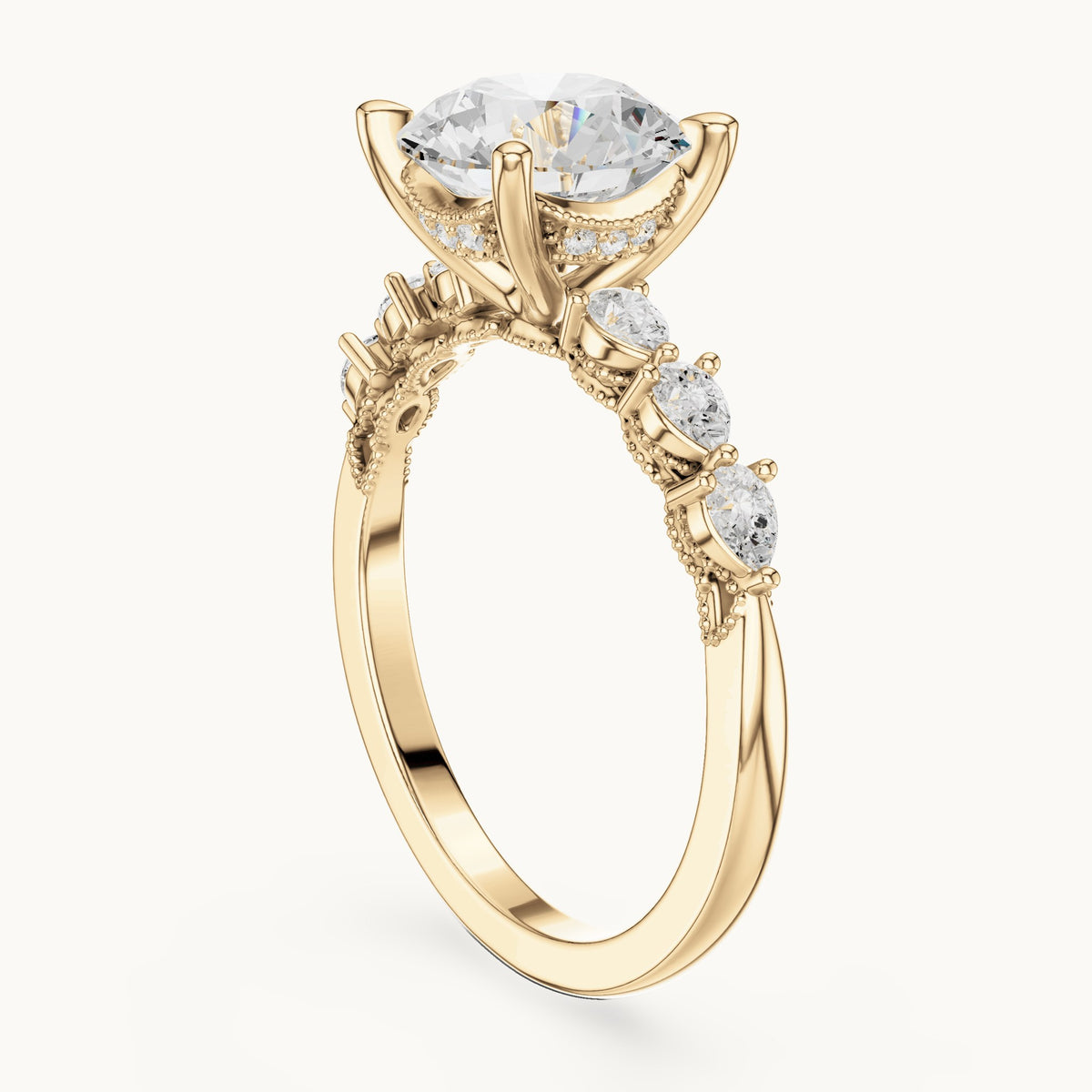 Round and pear lab-grown diamond engagement ring with pear side stones in yellow gold, 2.318 CT TW, view 1