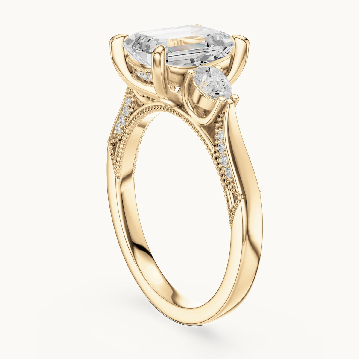 Emerald-cut, pear and round lab-grown diamond three-stone engagement ring with pear side stones in yellow gold, 2.475 CT TW, view 1