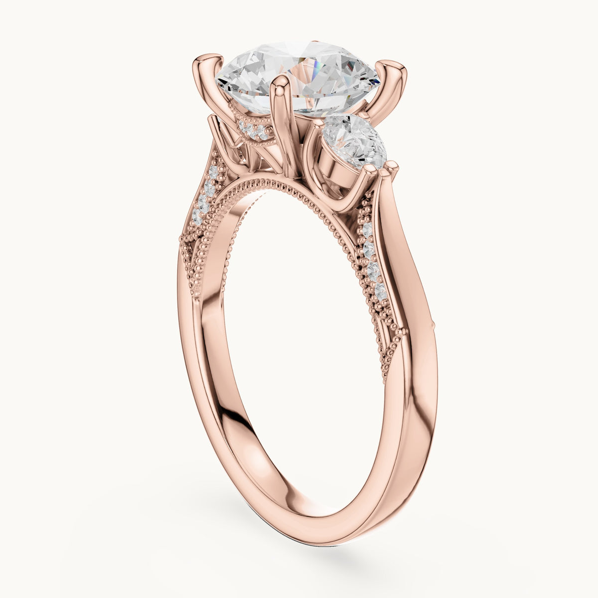 Round and pear lab-grown diamond three-stone engagement ring with pear side stones in rose gold, 2.375 CT TW, view 1