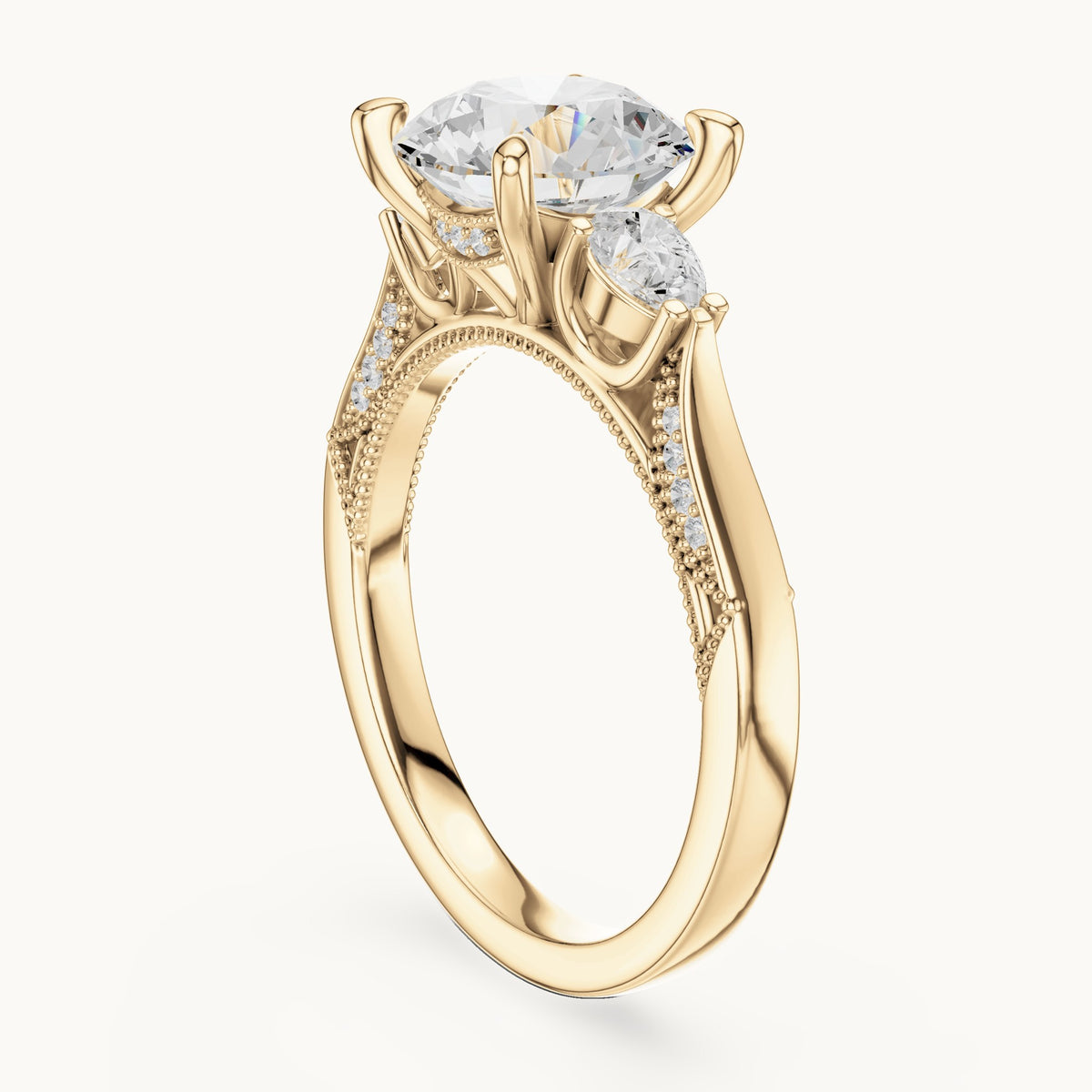 Round and pear lab-grown diamond three-stone engagement ring with pear side stones in yellow gold, 2.375 CT TW, view 1