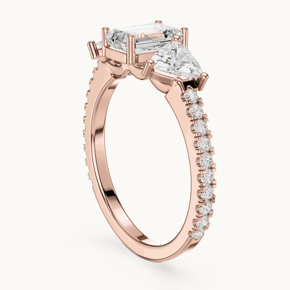Emerald-cut, trillion and round lab-grown diamond three-stone engagement ring with trillion side stones in rose gold, 1.85 CT TW, view 1