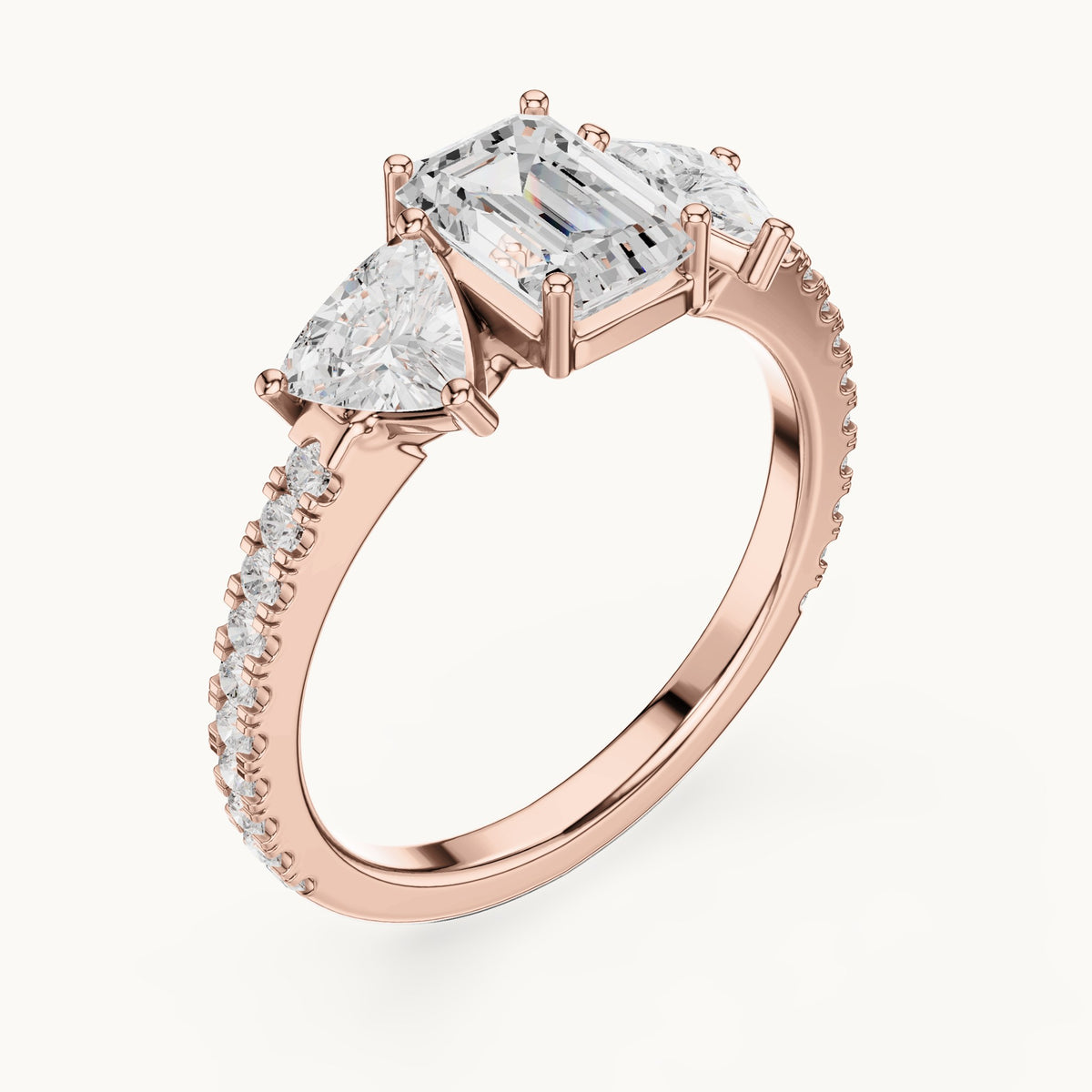Emerald-cut, trillion and round lab-grown diamond three-stone engagement ring with trillion side stones in rose gold, 1.85 CT TW, view 2