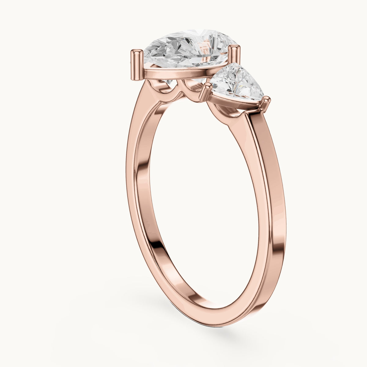 Pear and trillion lab-grown diamond three-stone engagement ring with trillion side stones in rose gold, 1.42 CT TW, view 1