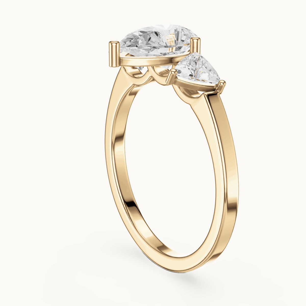 Pear and trillion lab-grown diamond three-stone engagement ring with trillion side stones in yellow gold, 1.42 CT TW, view 1