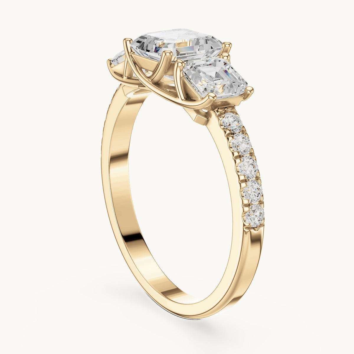 Square emerald-cut and round lab-grown diamond three-stone pavé engagement ring in yellow gold, 2.19 CT TW, view 1