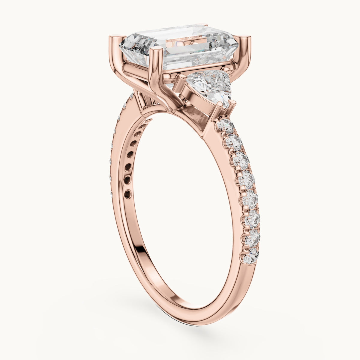 Emerald-cut, trillion and round lab-grown diamond three-stone engagement ring with trillion side stones in rose gold, 3.25 CT TW, view 1