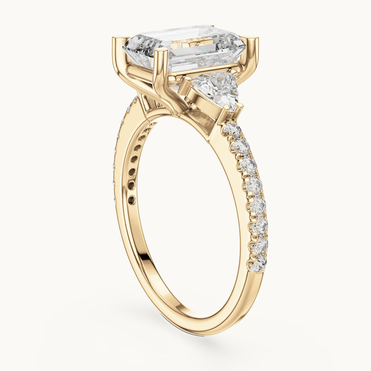 Emerald-cut, trillion and round lab-grown diamond three-stone engagement ring with trillion side stones in yellow gold, 3.25 CT TW, view 1
