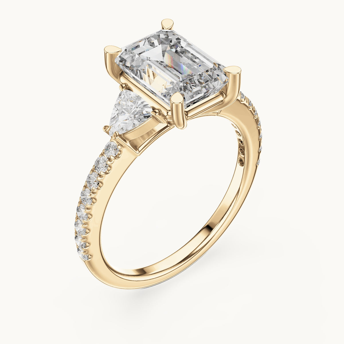 Emerald-cut, trillion and round lab-grown diamond three-stone engagement ring with trillion side stones in yellow gold, 3.25 CT TW, view 2
