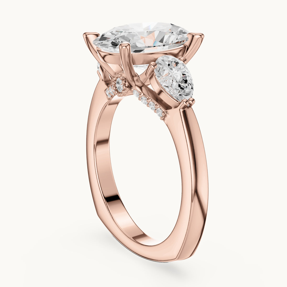 Oval, pear and round lab-grown diamond three-stone engagement ring with pear side stones in rose gold, 3.716 CT TW, view 1