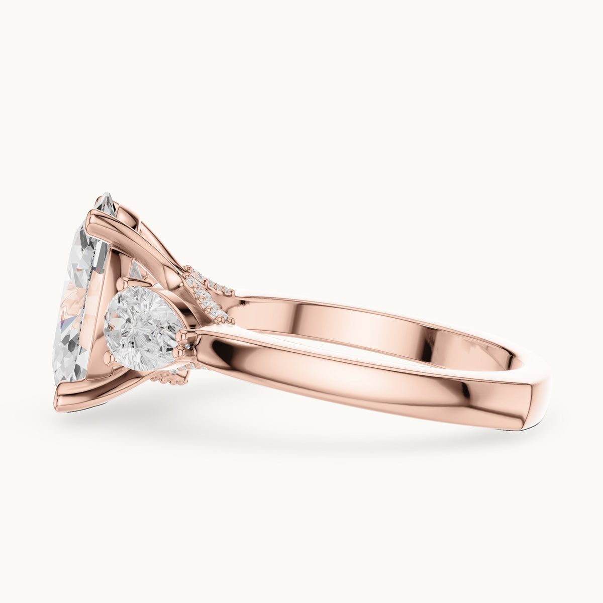 Oval, pear and round lab-grown diamond three-stone engagement ring with pear side stones in rose gold, 3.716 CT TW, view 3