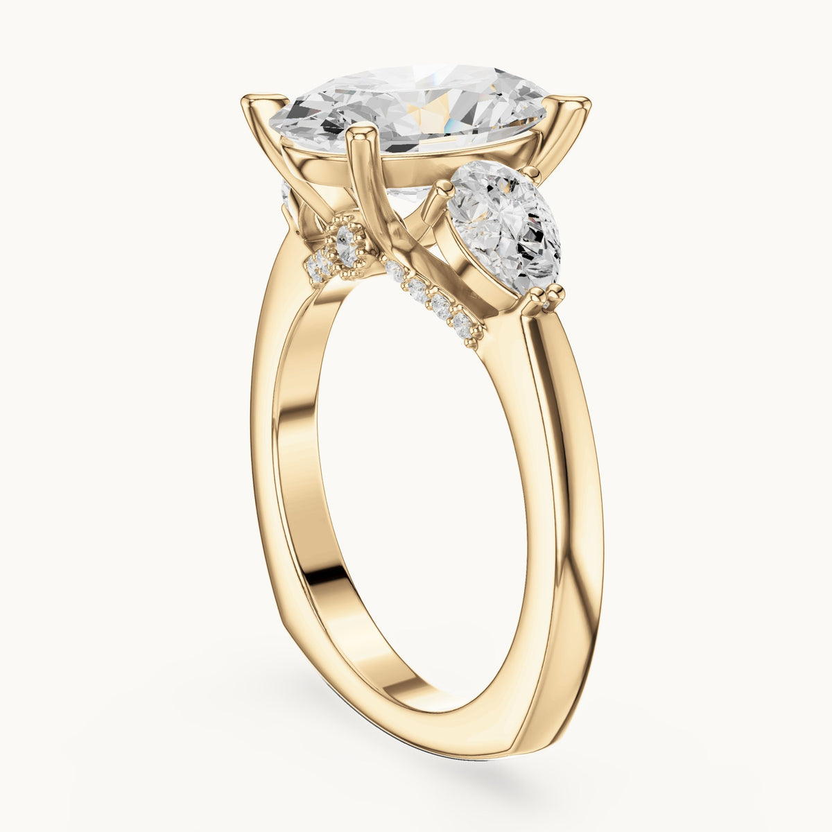Oval, pear and round lab-grown diamond three-stone engagement ring with pear side stones in yellow gold, 3.716 CT TW, view 1