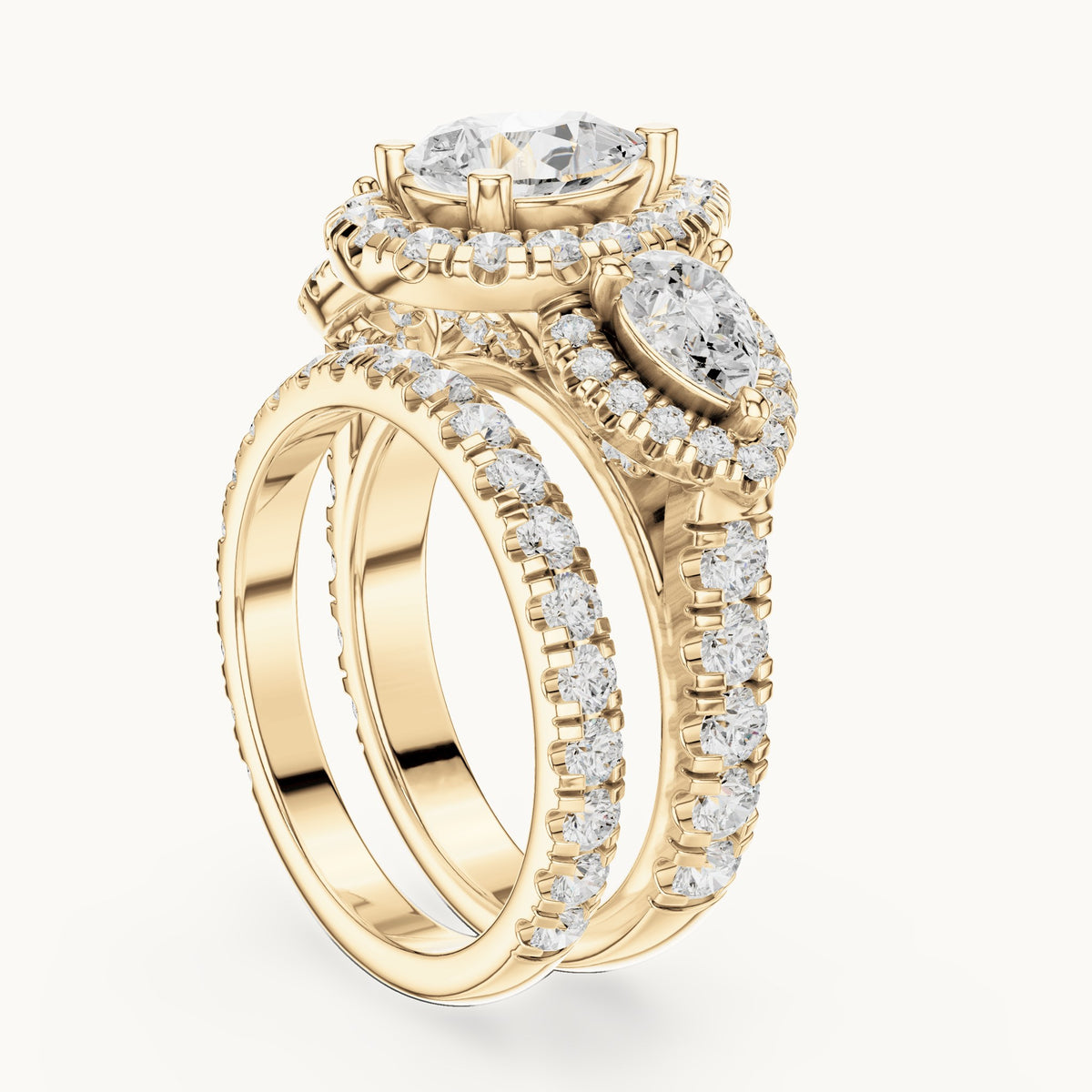Pear and round lab-grown diamond halo three-stone double band engagement ring in yellow gold, 4.323 CT TW, view 1