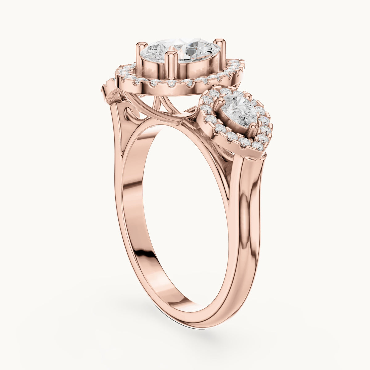 Pear and round lab-grown diamond halo three-stone engagement ring in rose gold, 3.096 CT TW, view 1