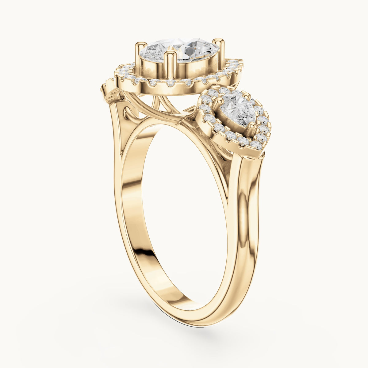 Pear and round lab-grown diamond halo three-stone engagement ring in yellow gold, 3.096 CT TW, view 1