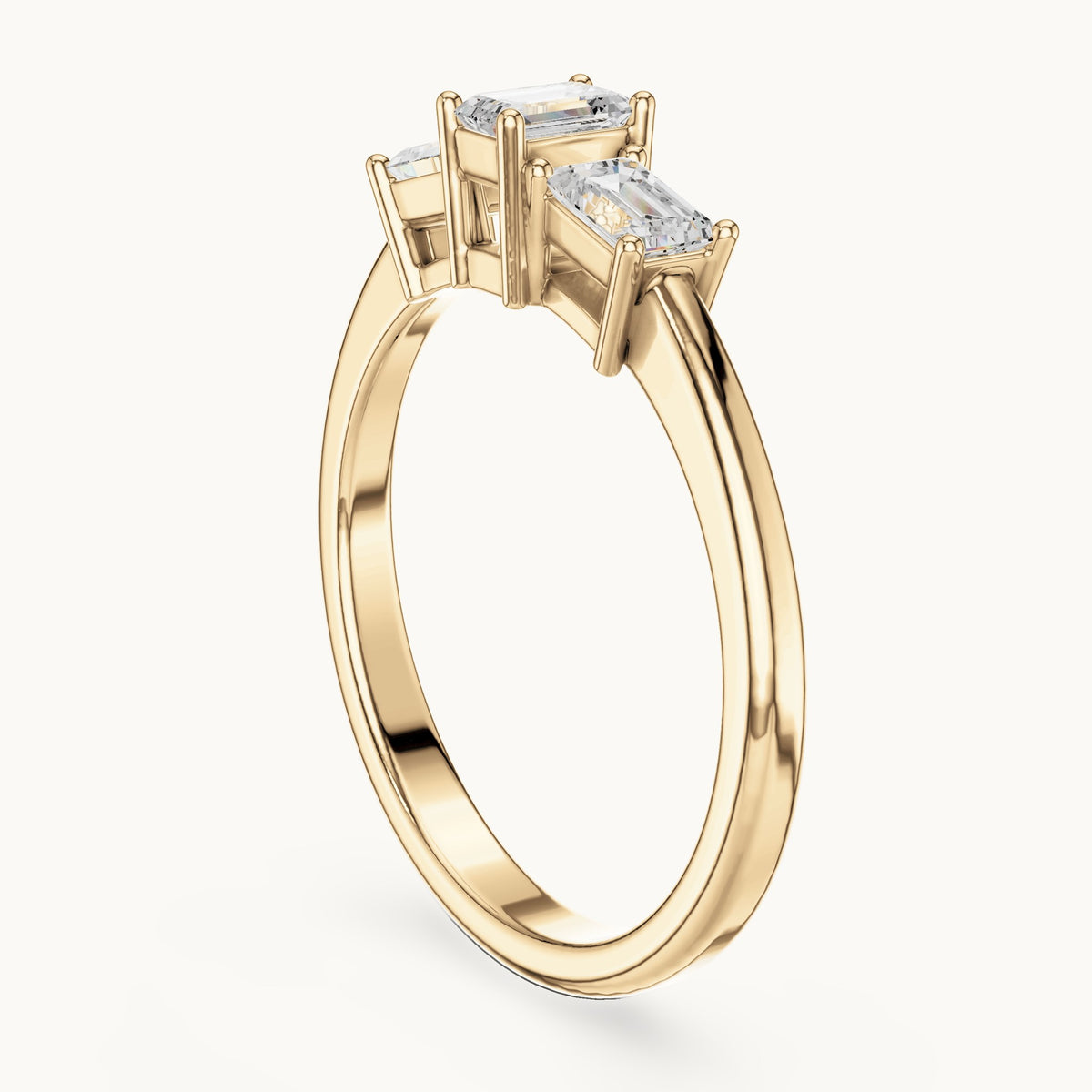 Emerald-cut lab-grown diamond three-stone engagement ring in yellow gold, 1.68 CT TW, view 1