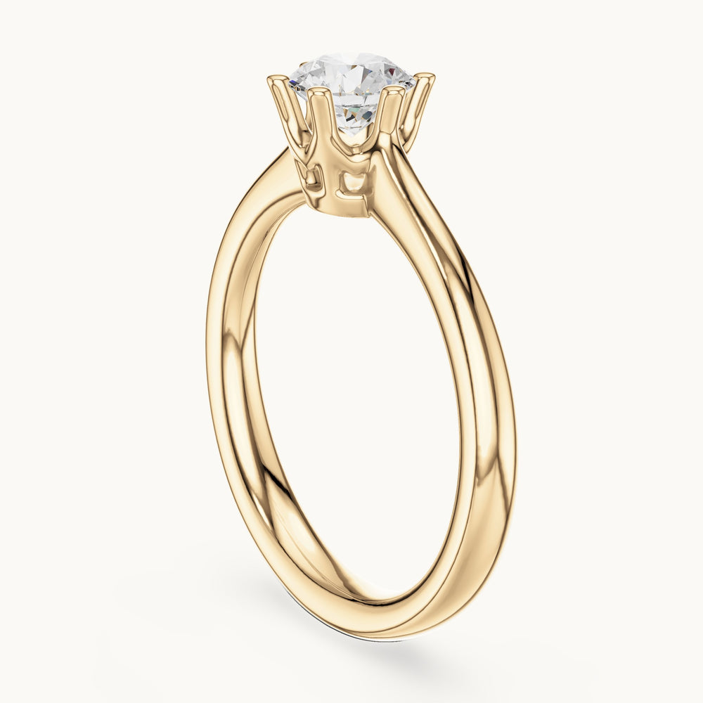 Round lab-grown diamond solitaire engagement ring in yellow gold, 0.63 CT TW, view 1
