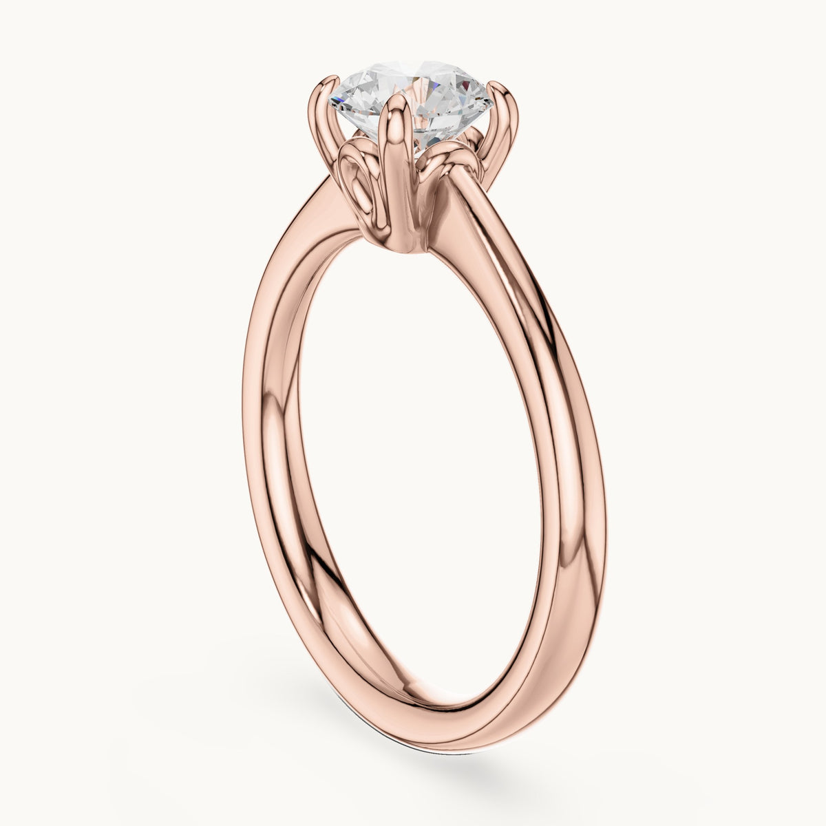 Round lab-grown diamond swirl-gallery four-prong solitaire engagement ring in rose gold, 0.85 CT TW, view 1