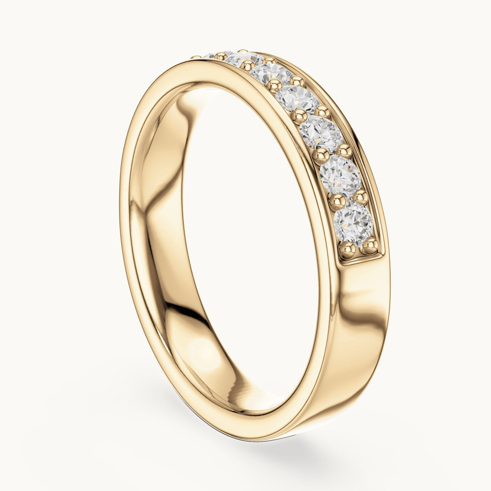 Round lab-grown diamond channel-set band in yellow gold, 0.49 CT TW, view 1