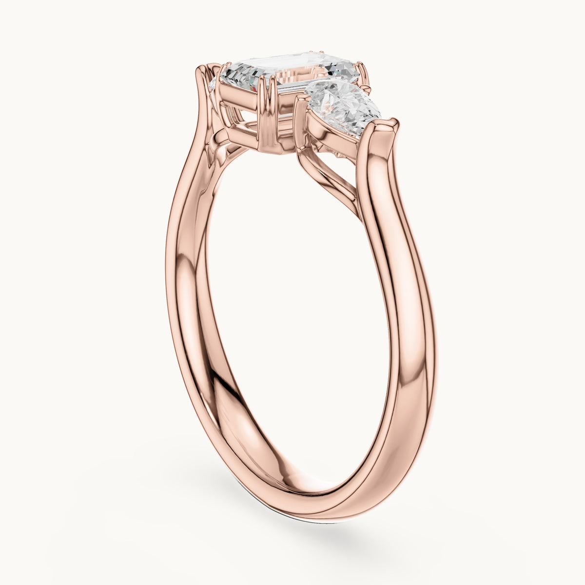 Emerald and pear lab-grown diamond three-stone engagement ring in rose gold, 0.89 CT TW, view 1