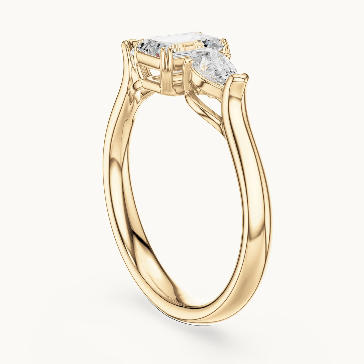 Emerald and pear lab-grown diamond three-stone engagement ring in yellow gold, 0.89 CT TW, view 1