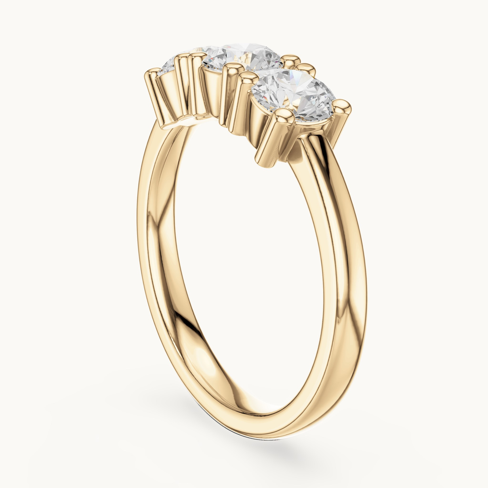 Round lab-grown diamond three stone ring in 14K yellow gold, 0.99 CT TW, view 1
