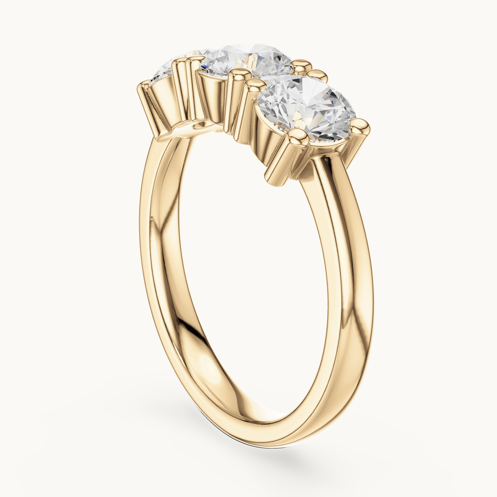 Round lab-grown diamond three stone ring in 14K yellow gold, 1.50 CT TW, view 1