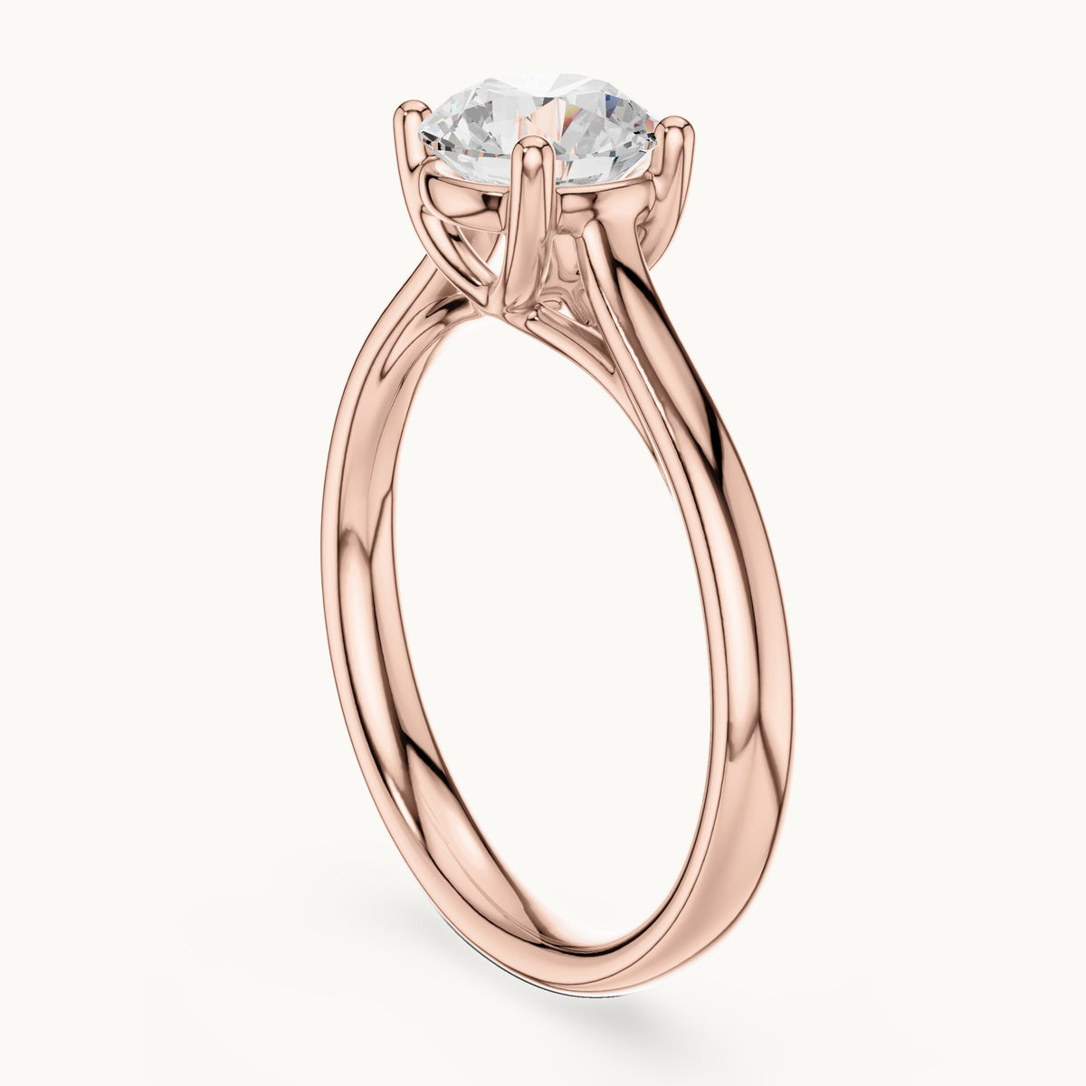 Round lab-grown diamond open cathedral four-prong solitaire engagement ring in rose gold, 1.10 CT TW, view 1