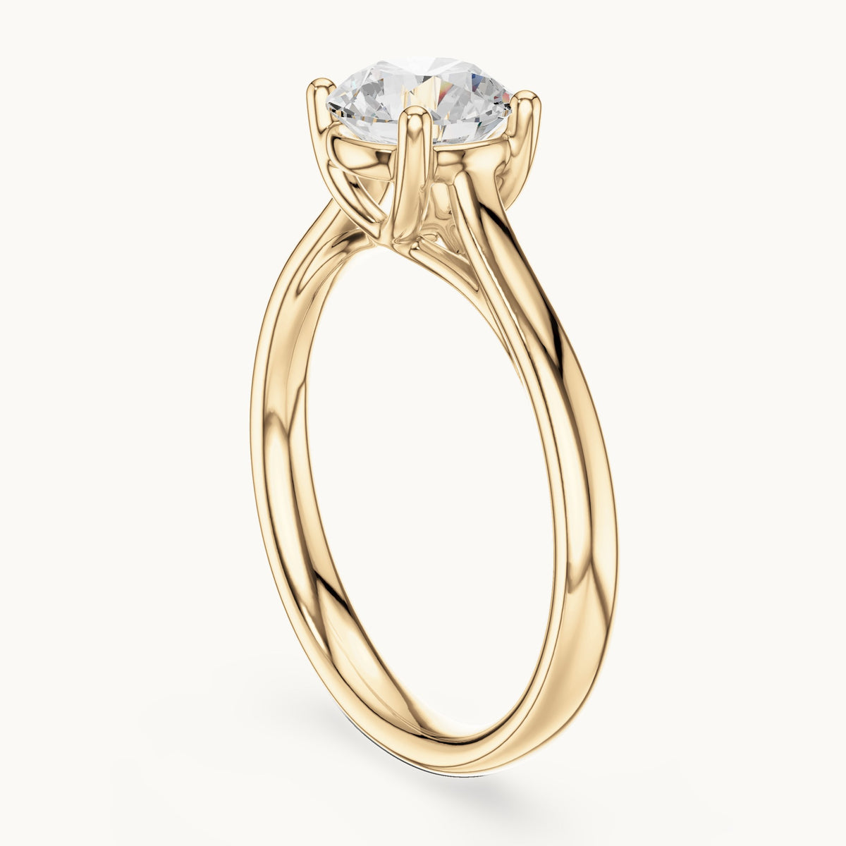 Round lab-grown diamond open cathedral four-prong solitaire engagement ring in yellow gold, 1.10 CT TW, view 1