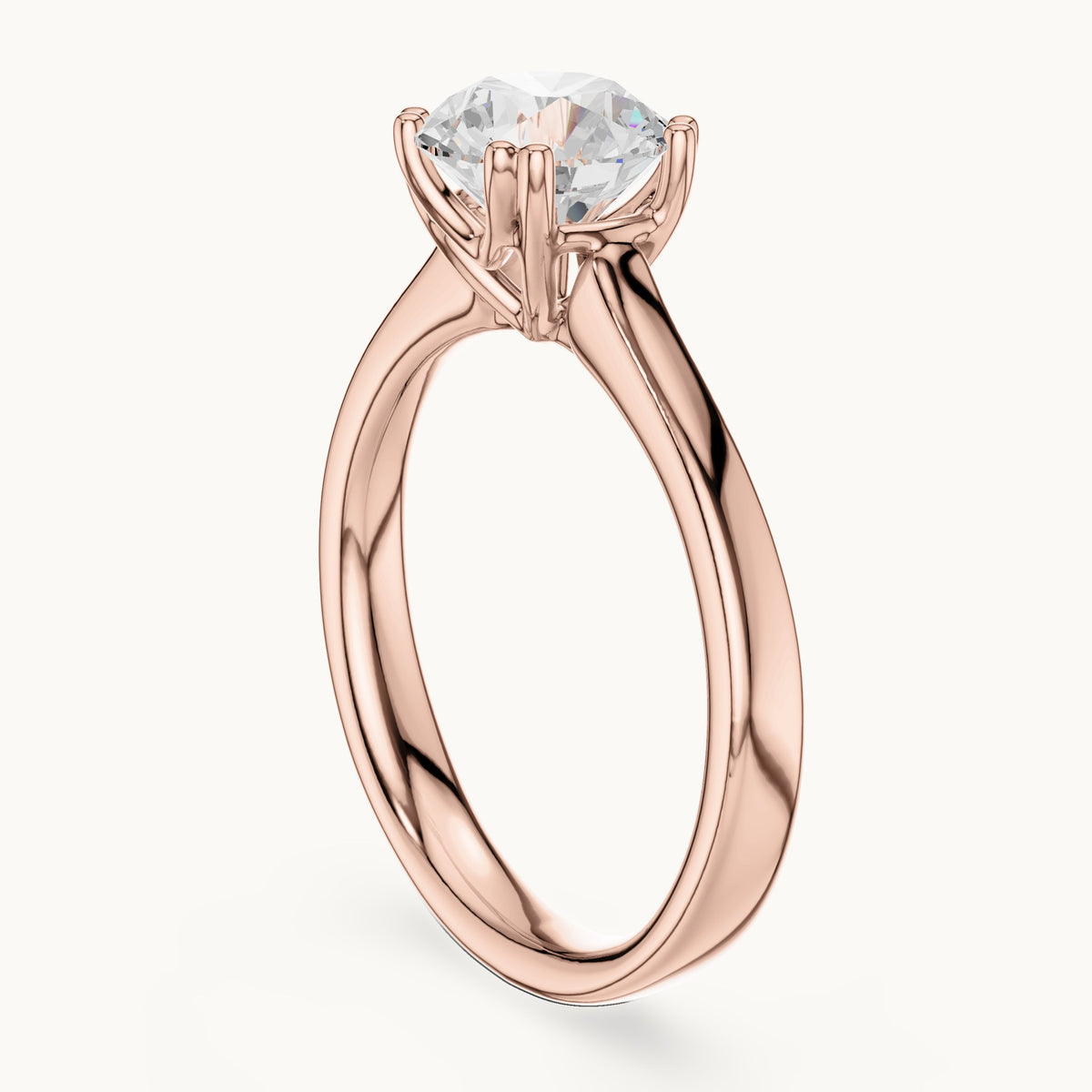 Round lab-grown diamond scroll-gallery four-prong solitaire engagement ring in rose gold, 1.10 CT TW, view 1