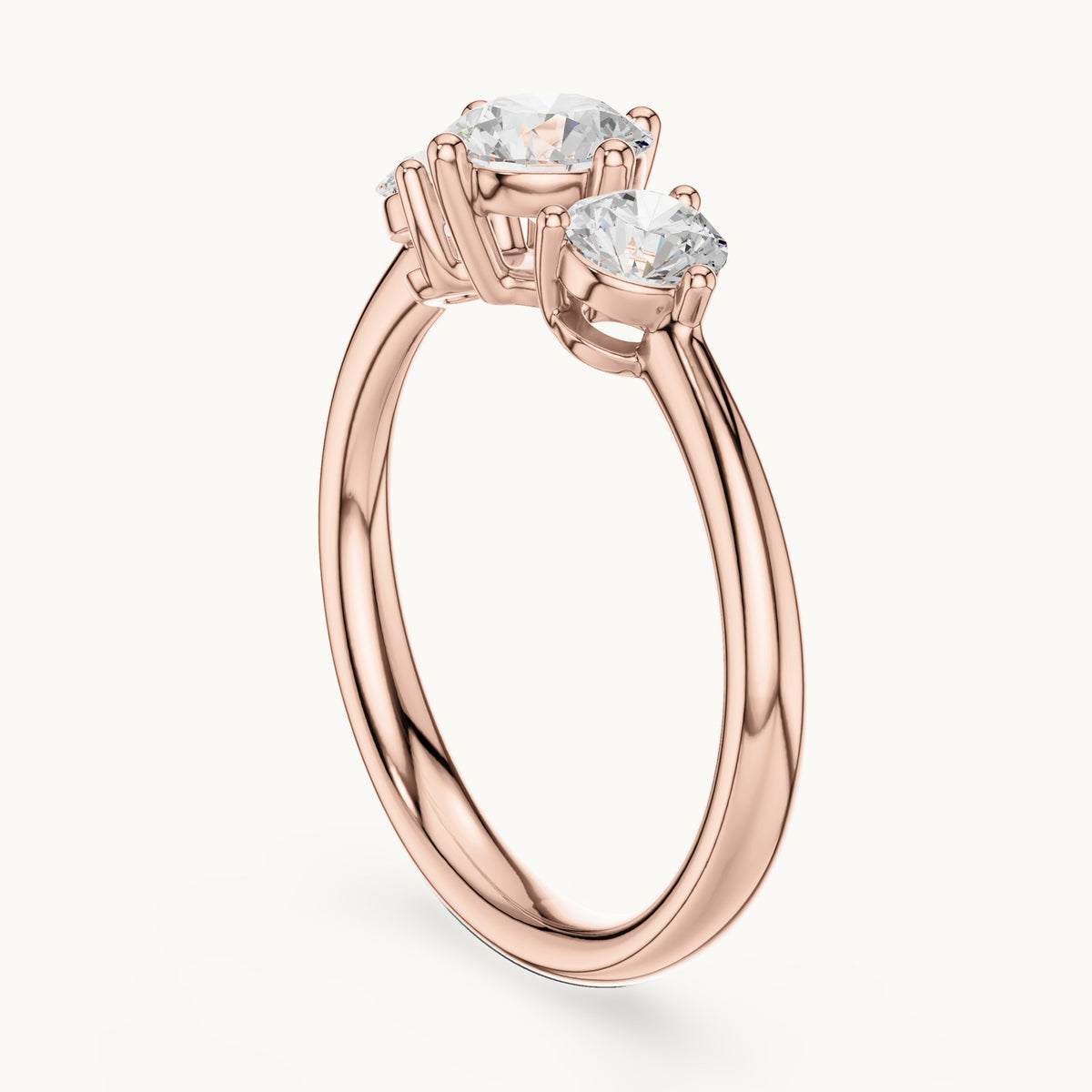Round lab-grown diamond three-stone engagement ring in rose gold, 1.29 CT TW, view 1
