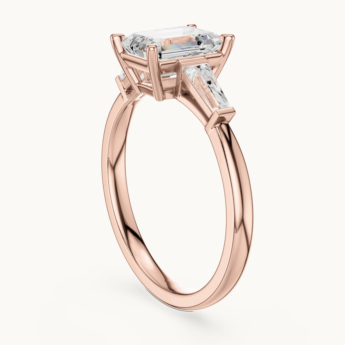 Emerald-cut lab-grown diamond three-stone engagement ring with tapered baguettes in rose gold, 1.82 CT TW, view 1