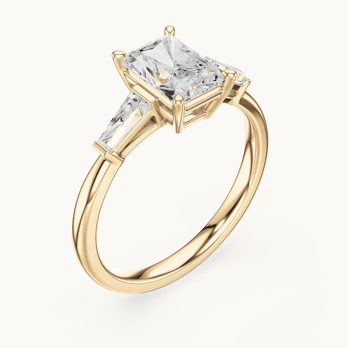 Radiant-cut lab-grown diamond three-stone engagement ring with tapered baguettes in yellow gold, 2.07 CT TW, view 2