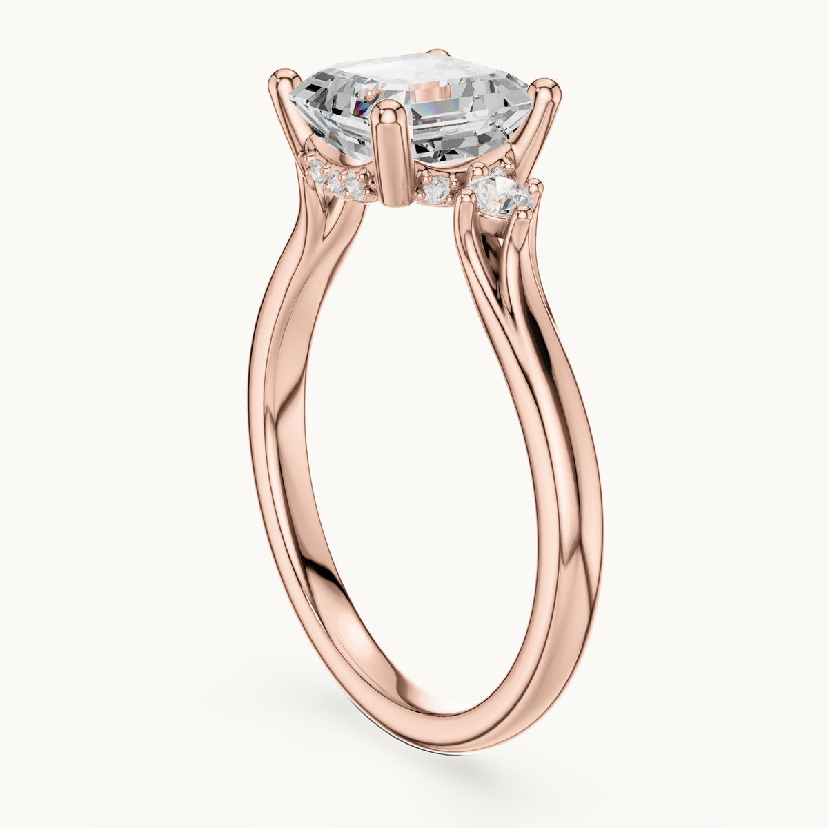 Square emerald-cut and round lab-grown diamond three-stone engagement ring with hidden halo in rose gold, 1.93 CT TW, view 1