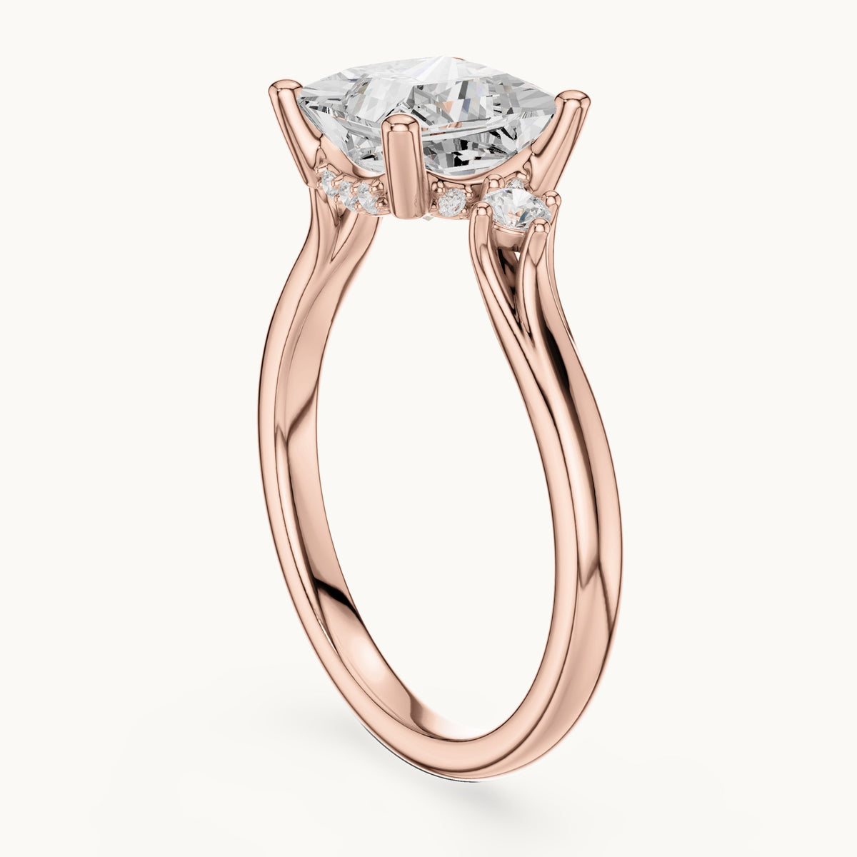 Princess-cut and round lab-grown diamond three-stone engagement ring with hidden halo in rose gold, 2.30 CT TW, view 1