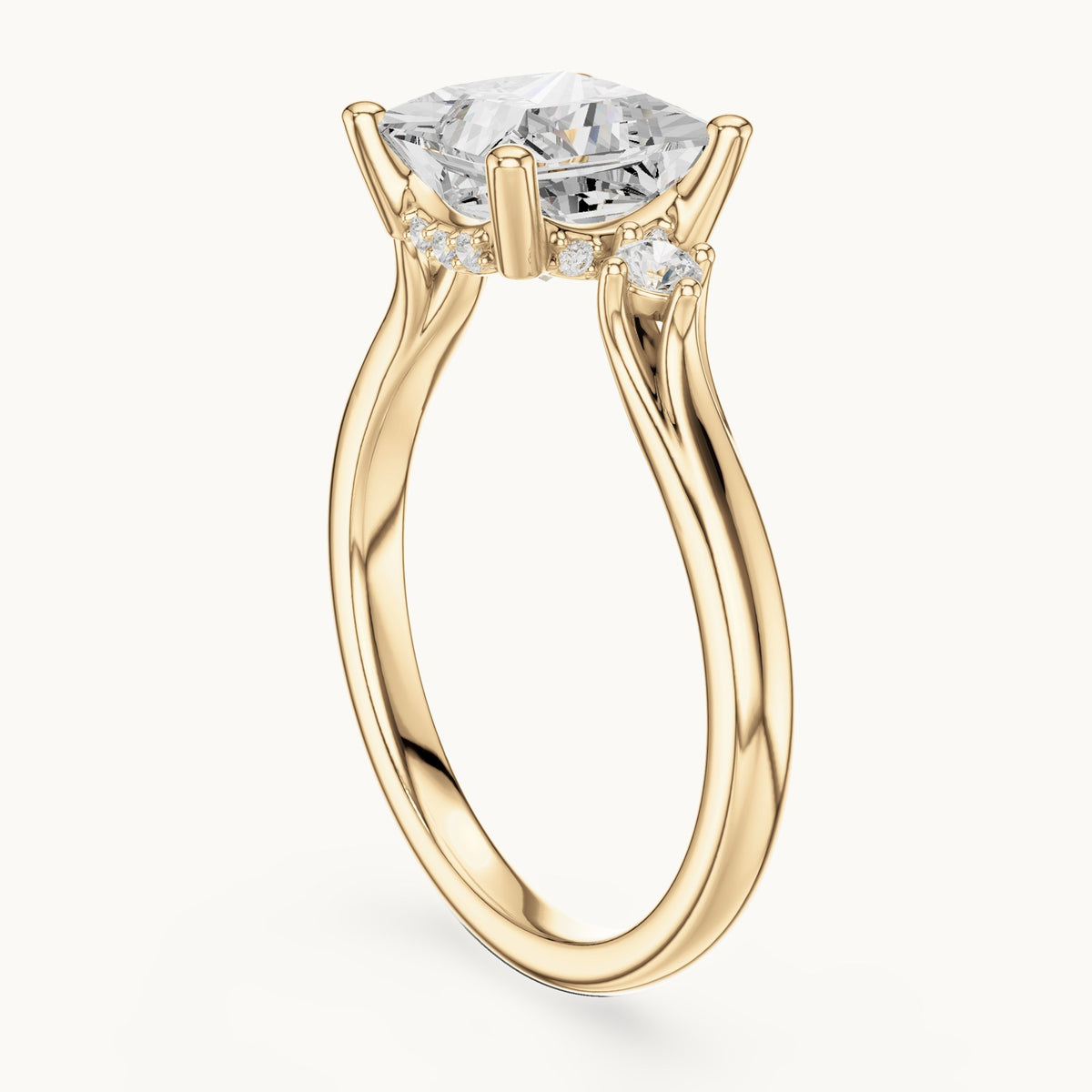 Princess-cut and round lab-grown diamond three-stone engagement ring with hidden halo in yellow gold, 2.30 CT TW, view 1