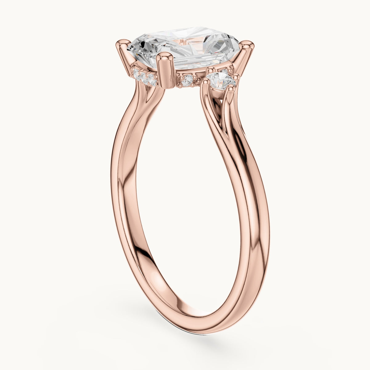 Radiant-cut and round lab-grown diamond three-stone engagement ring with hidden halo in rose gold, 2.13 CT TW, view 1