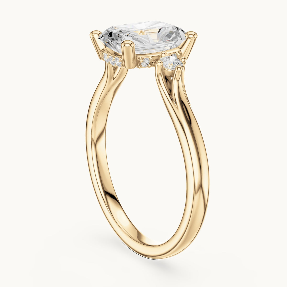 Radiant-cut and round lab-grown diamond three-stone engagement ring with hidden halo in yellow gold, 2.13 CT TW, view 1