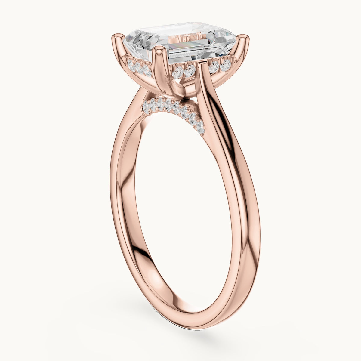 Emerald-cut and round lab-grown diamond hidden halo solitaire engagement ring in rose gold, 2.23 CT TW, view 1