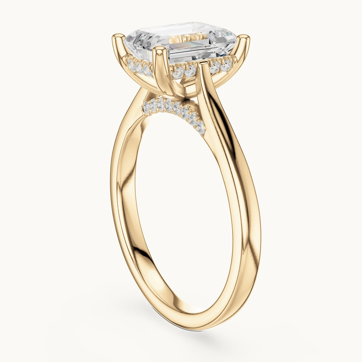Emerald-cut and round lab-grown diamond hidden halo solitaire engagement ring in yellow gold, 2.23 CT TW, view 1