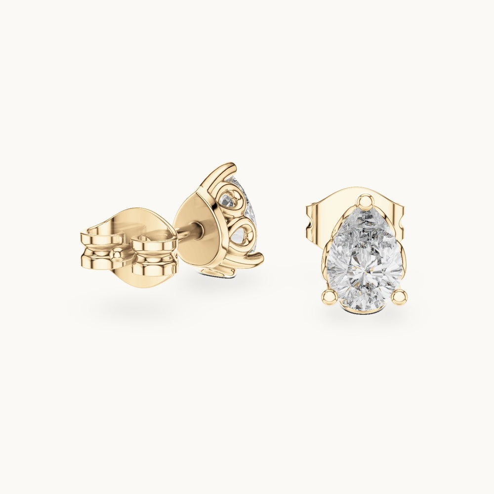 Pear lab-grown diamond solitaire stud earrings in yellow gold, 0.95 CT TW, view 1