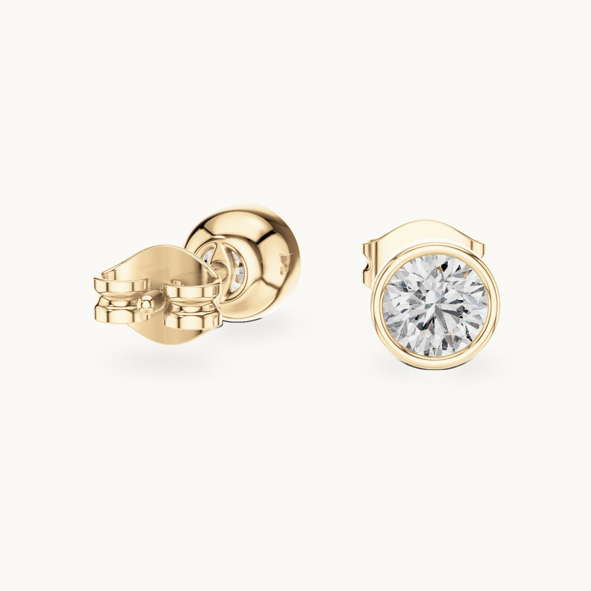 Round lab-grown diamond bezel stud earrings in yellow gold, 1.00 CT TW, view 1