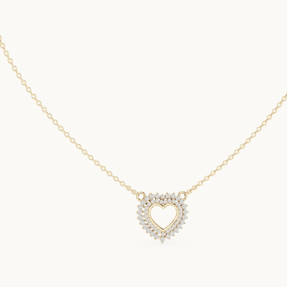 Round lab-grown diamond double halo heart pendant in yellow gold, 0.38 CT TW, view 1