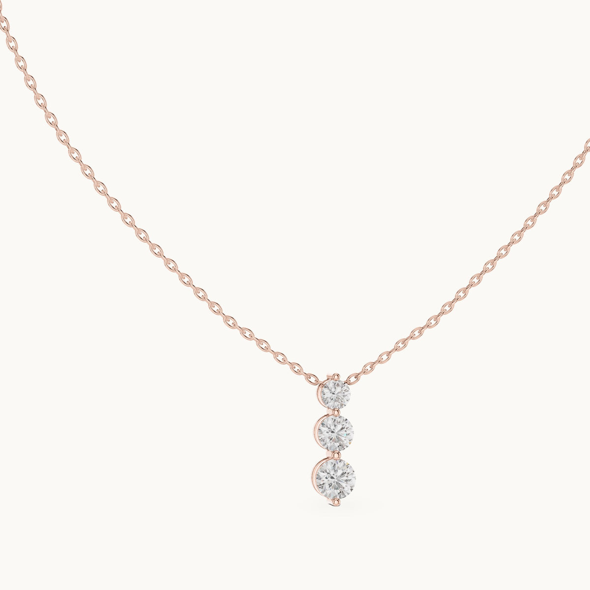 Round lab-grown diamond three-stone drop pendant in rose gold, 1.11 CT TW, view 1