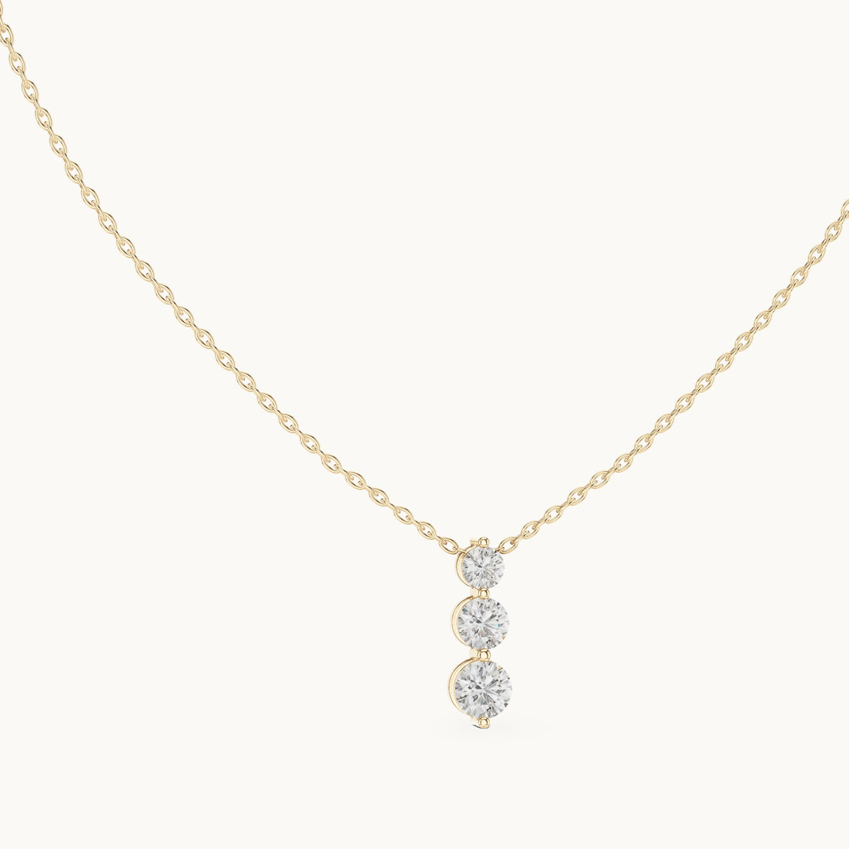 Round lab-grown diamond three-stone drop pendant in yellow gold, 1.11 CT TW, view 1
