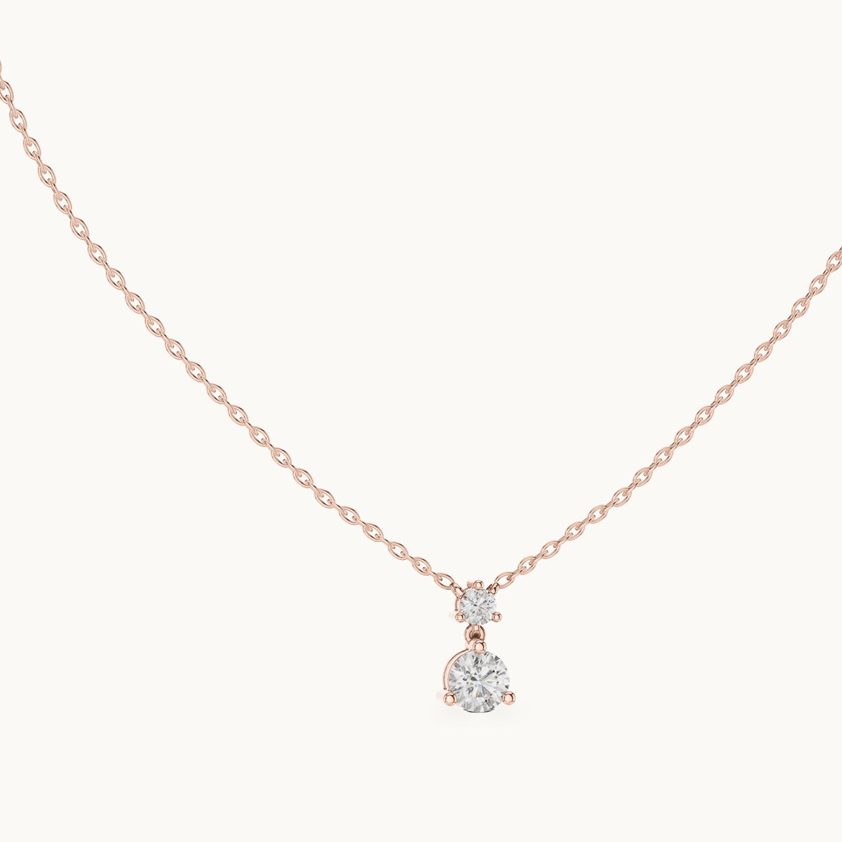 Round lab-grown diamond two-stone drop pendant in rose gold, 0.61 CT TW, view 1